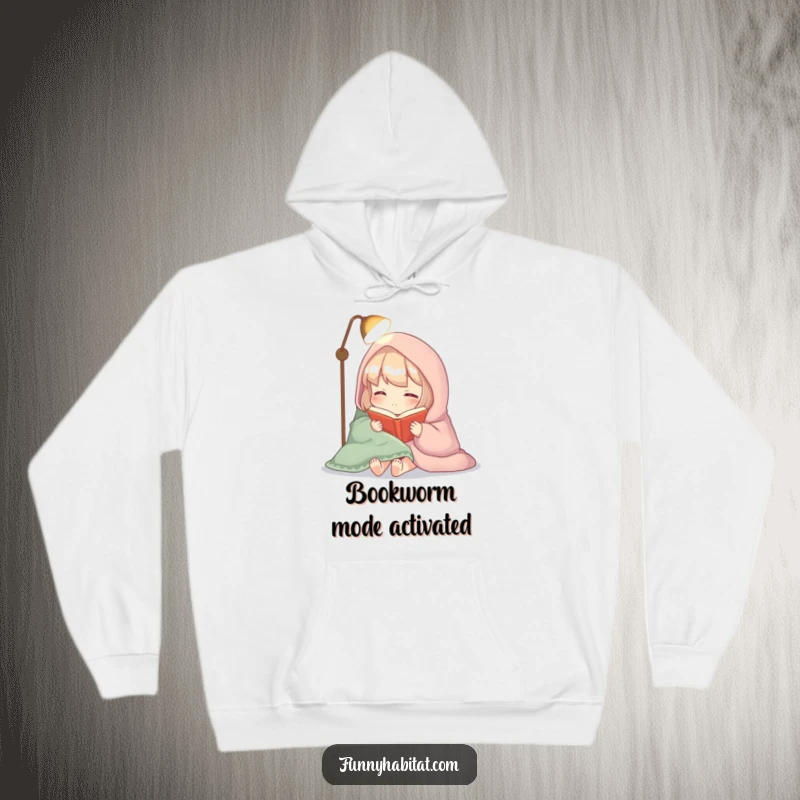 Funny hoodie depicting a character cozily wrapped in a blanket, reading a book by soft lamplight, perfect for lounging.