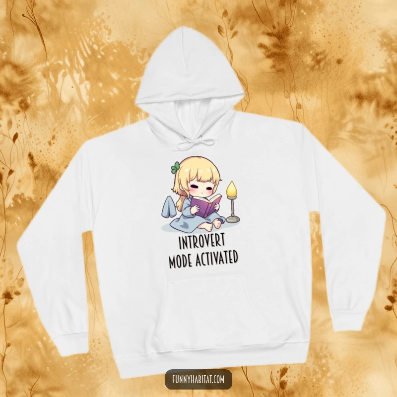 Funny hoodie with a charming character reading a book by a soft glowing lamp, offering warmth and a touch of literary humor.
